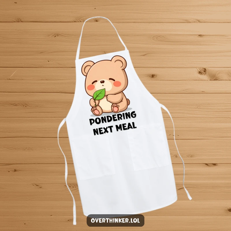 Funny Kawaii bear apron, a cute chef character intently focused on a single leaf while cooking, adding humorous flair.