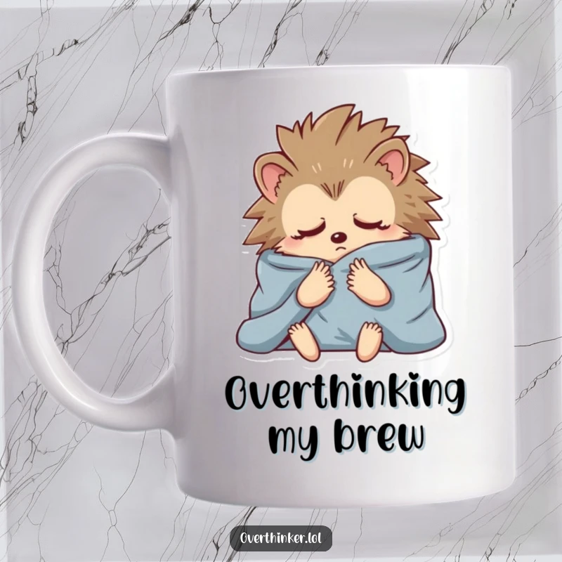 Funny mug showing a hedgehog bundled in blankets, eyes wide with anxious thoughts, perfect for embracing cozy worries.