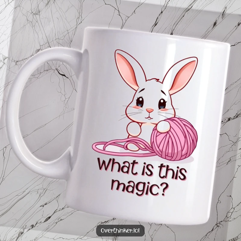 Funny mug featuring a confused rabbit with perked ears staring intently at a hopelessly tangled ball of yarn.