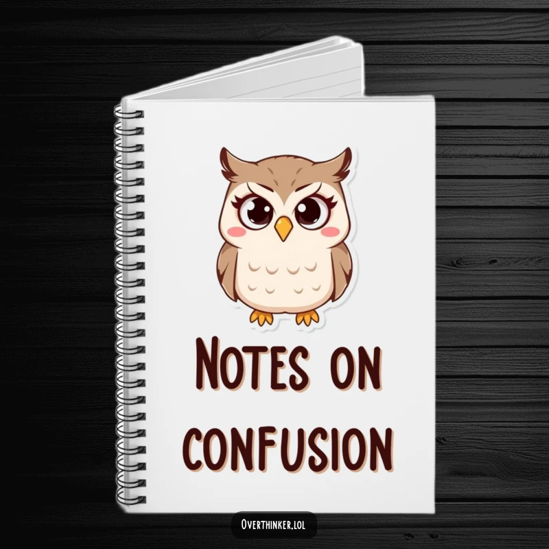 Funny Owl Notebook with a cover featuring a small owl character with wide, questioning eyes and a furrowed brow. Ideal for notes.