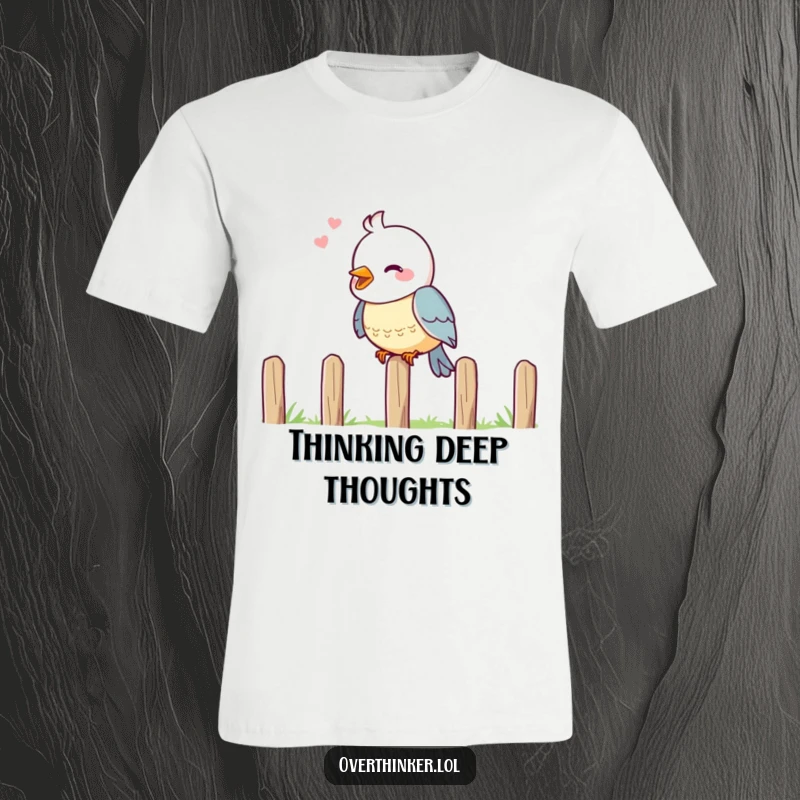 Funny t-shirt graphic of a cheerful bird sitting on a fence, head tilted in deep contemplation.