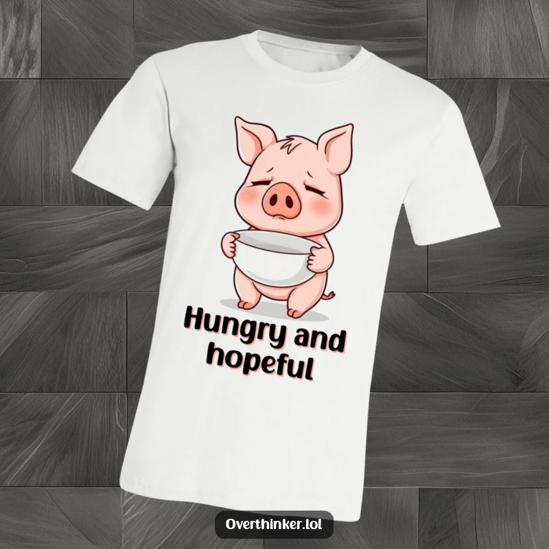 Funny t-shirt with a pig character nervously holding an empty bowl, symbolizing a perpetual state of hunger or desire for more.