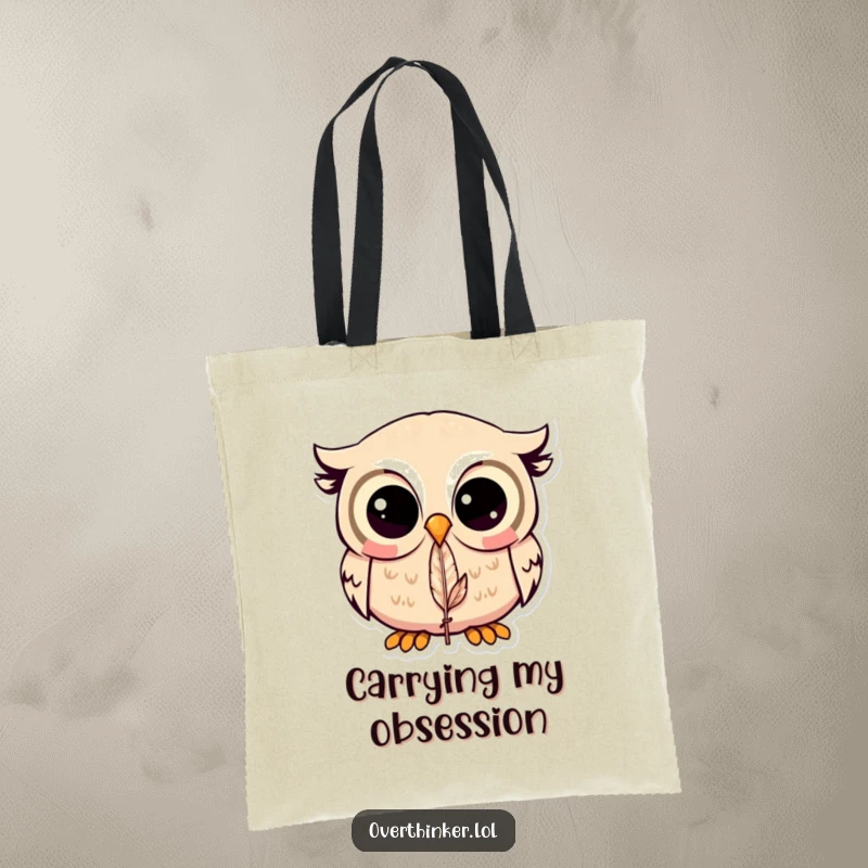 Funny Kawaii owl tote bag with a cute owl fixated on a feather, ideal for carrying items with a touch of humor.