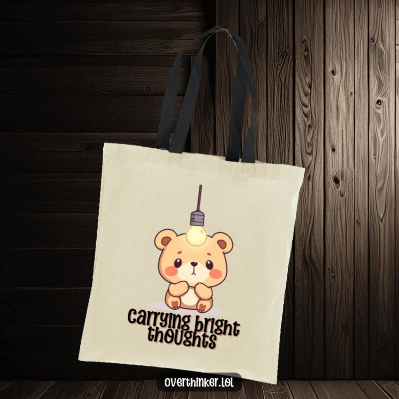 Funny bear tote bag featuring a concentrated bear gazing at a single, blinking lightbulb, perfect for carrying inspiration and essentials.