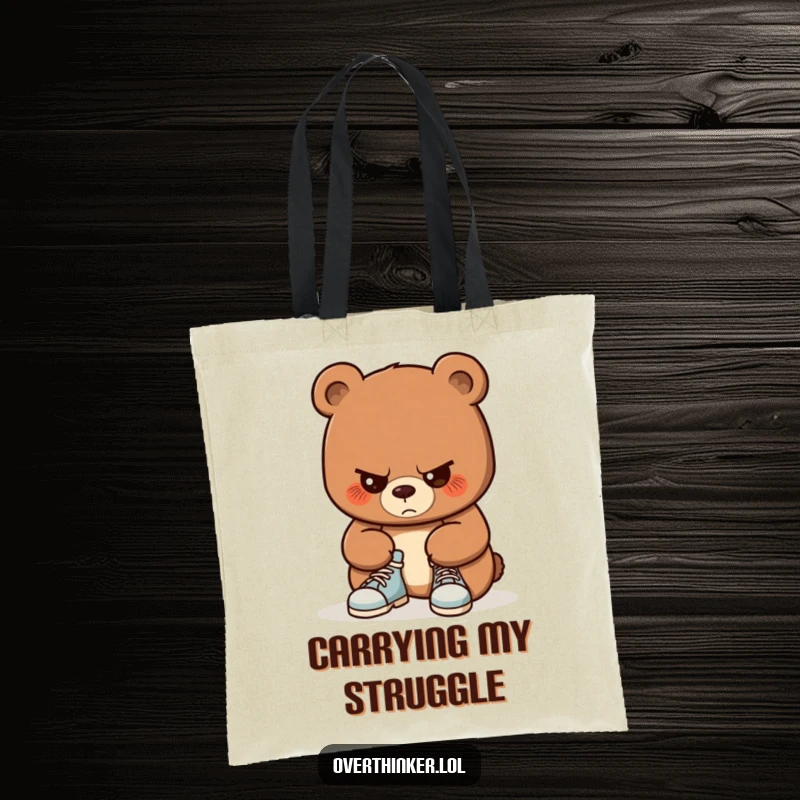 Funny tote bag with a bear concentrating intensely on tying its shoelaces. Practical and humorous for carrying daily items.