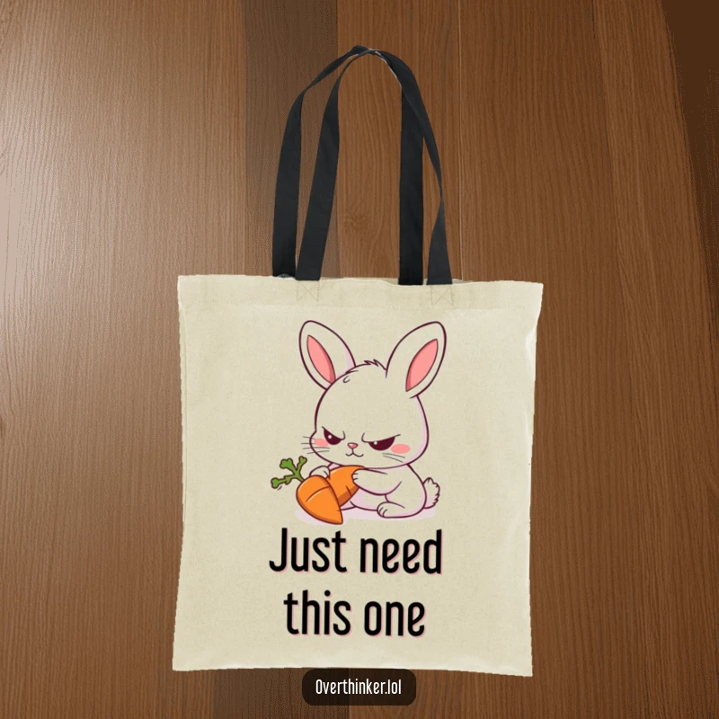 Funny Rabbit Tote Bag featuring a rabbit with a furrowed brow intensely focused on a single carrot, practical art.
